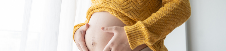 gestante segurando barriga cansaco segunda gestacao maternidade