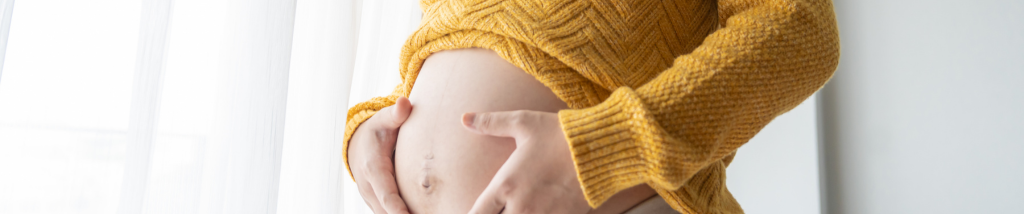 gestante segurando barriga cansaco segunda gestacao maternidade